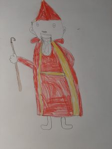 Kinderzeichnung eines Mannes in rotem Gewand